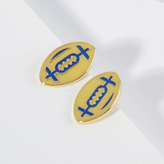 Gold and blue football earrings on a white background