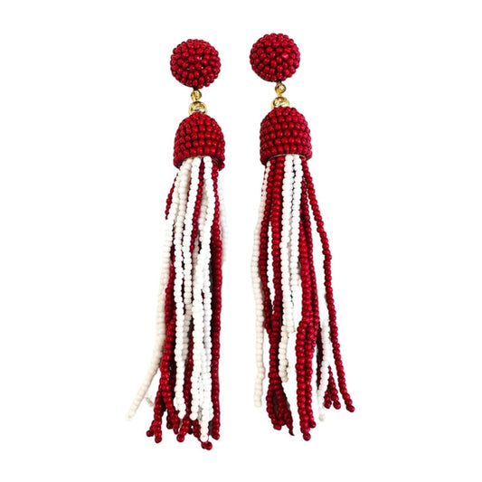 Red and white beaded tassel earrings on a white background